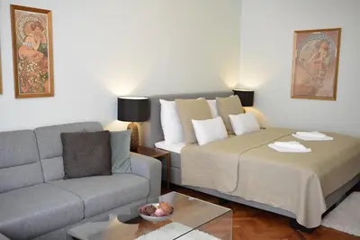 a living room with a couch and a bed at Apartment in the heart of Prague in Prague