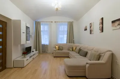 a large living room with a couch and a tv at Spacious apartment near Wenceslas Square in Prague