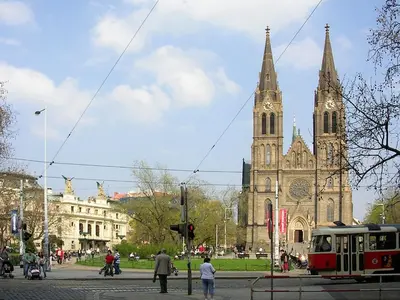 a church with two towers with a clock on it at Spacious apartment near Wenceslas Square in Prague