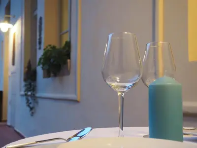 two wine glasses sitting on top of a table at Apartment Nebovidy I - Historic centre - Terrace - Air Conditioning in Prague