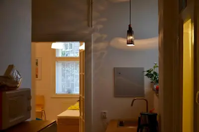 a room with a kitchen with a sink and a window at Old Town Basement in Prague