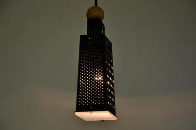 a light that is hanging from a ceiling at Old Town Basement in Prague