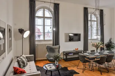 a living room with a couch and a table at Lazenska N4 Residence in Prague