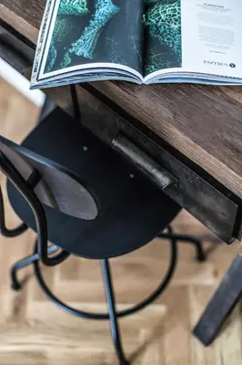 a book sitting on top of a wooden table at Lazenska N4 Residence in Prague