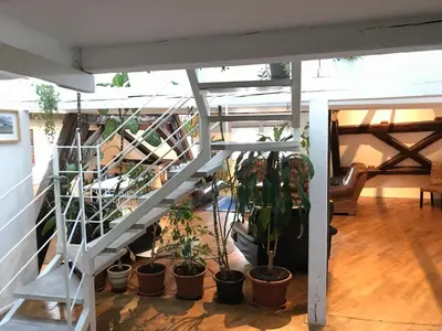 a staircase with potted plants in a room at DN Pub Apartments in Prague