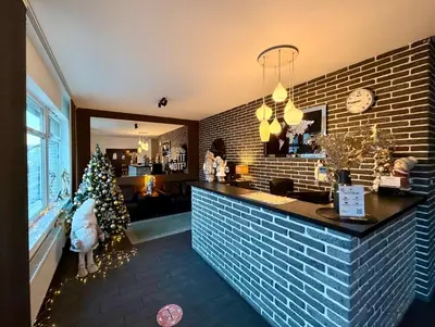 a bar with a christmas tree in a room at Grand Petit Hotel ex Shato Gesson in Prague