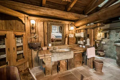 a bathroom with a sink in a wooden cabin at Luxusní srub Líny in Bukovno