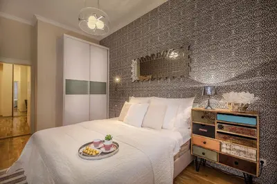 a bedroom with a bed with a tray of food on it at Prague Days - Luxurious Apartments Lesser Town in Prague