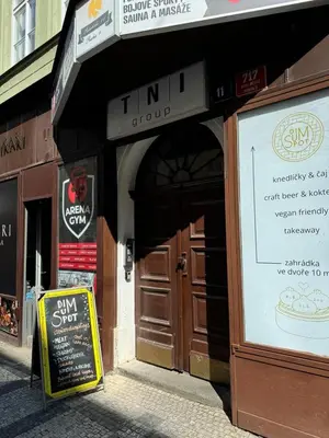 a store with a sign in front of a building at Palackeho Apartment in Prague