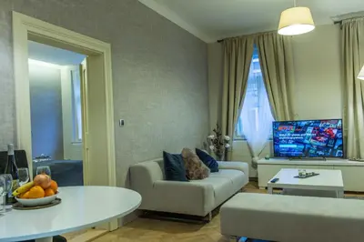 a living room with a couch and a table at Exclusive 3 Bedroom Top-Notch Flat, GREAT LOCATION in Prague