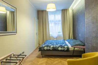 a bedroom with a bed and a large window at Exclusive 3 Bedroom Top-Notch Flat, GREAT LOCATION in Prague