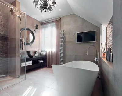 a bathroom with a large white tub and a chandelier at PALOMA Průhonice in Pruhonice