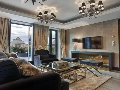 a living room with a couch and a fireplace at PALOMA Průhonice in Pruhonice