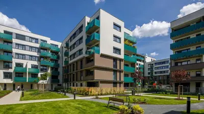an apartment building with a park in front of it at Nice and refreshing flat in Prague in Prague