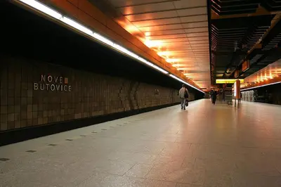 a subway station with a man walking on the platform at Nice and refreshing flat in Prague in Prague