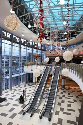 a large building with escalators and chandeliers at Nice and refreshing flat in Prague in Prague