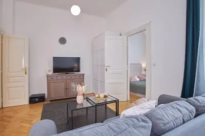 a living room with a couch and a table at Charles Bridge Premium Residence in Prague