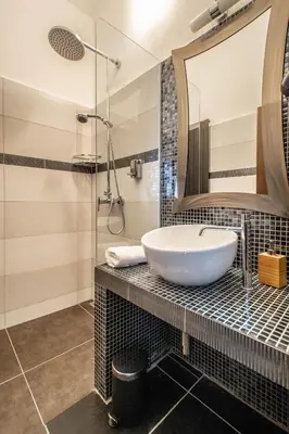a bathroom with a sink and a mirror at Stylish Apartments close to Eden Garden in Prague