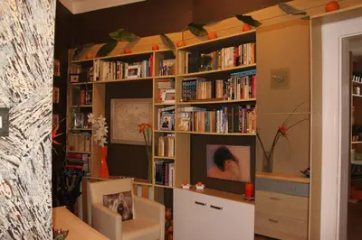 a room with book shelves filled with books at Cosy Apartment Under the Tower in Prague