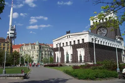 a building with a clock tower on top of it at Cosy Apartment Under the Tower in Prague