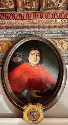 a painting of a portrait of a man on a wall at Alchymist Prague Castle Suites Hotel in Prague