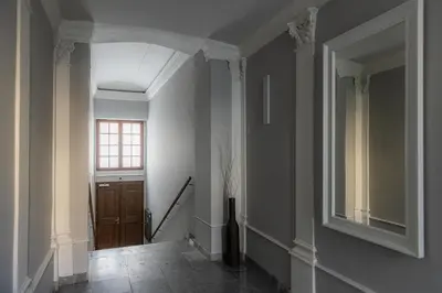 a hallway with a door and a window at Nice big apartment 2bds - Belgicka in Prague