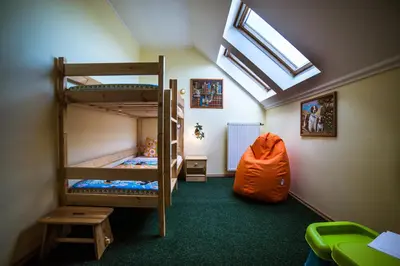 a bedroom with two beds and a window at Prague Sweet Home in Prague