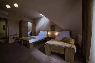 a room with a bed and a table and chairs at Prague Sweet Home in Prague