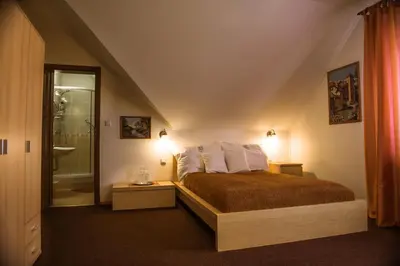 a bedroom with a bed with a red blanket at Prague Sweet Home in Prague