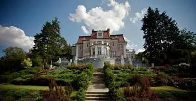 a large house with a staircase leading up to it at Rezidence Liběchov in Liběchov