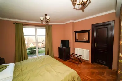 a bedroom with a bed and a window at Rezidence Liběchov in Liběchov