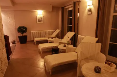 a waiting room with white chairs and tables at Rezidence Liběchov in Liběchov