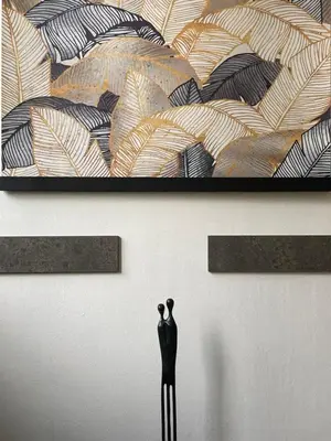 a statue of a mannequin in front of a wall at Apartments near the pond in Prague