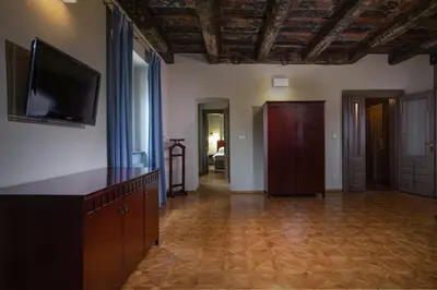 a living room with a flat screen tv on the wall at Charles Bridge Heritage Suites by SALVATOR HOTELS in Prague