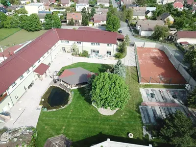 an aerial view of a house with a yard at Hotel Dvůr in Krnsko