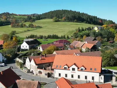 an aerial view of a village with red roofs at Penzion U Švarců in Zduchovice