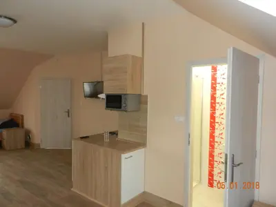 a room with a kitchen with a counter top at Penzion AMÁLKA Černín in Zdice