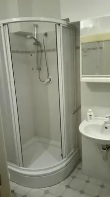 a bathroom with a shower and a sink at Zderaz in Prague