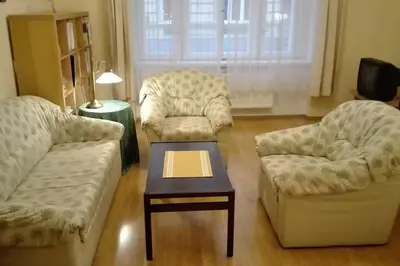 a living room with two couches and a coffee table at Zderaz in Prague