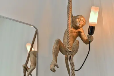 a statue of a monkey on a rope with a lamp at Drama Queen in Old Town Prague in Prague