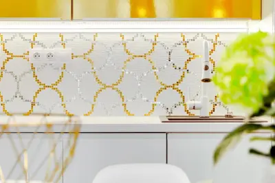 a kitchen with a yellow and white wall at Drama Queen in Old Town Prague in Prague