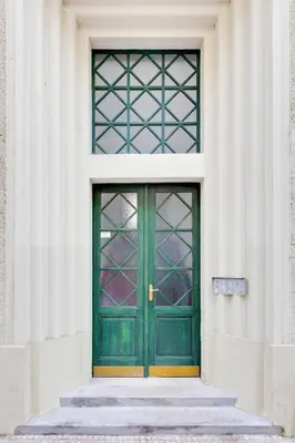 a green door on the side of a building at Drama Queen in Old Town Prague in Prague