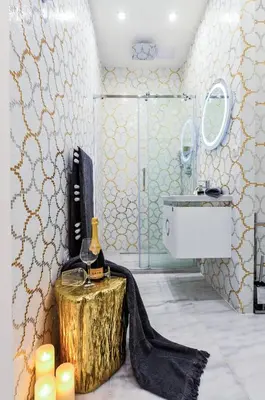 a bathroom with a bottle of wine on a tree stump in a room at Drama Queen in Old Town Prague in Prague