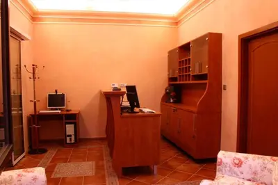 a room with a desk with a computer on it at Zlaty Lev in Louny