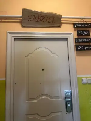 a door in a building with a sign above it at ARTHARMONY Pension & Hostel in Prague