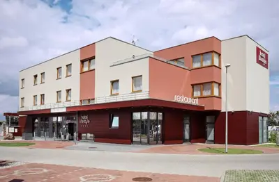 a red and white building on a street at Hotel Lifestyle in Prague