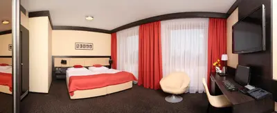 a hotel room with a bed and a television at Hotel Lifestyle in Prague