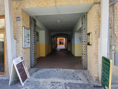an empty hallway of a building with a sign in it at Hotel Koruna in Roudnice nad Labem