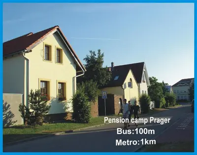 a group of people standing in front of a house at Pension Camp Prager in Prague