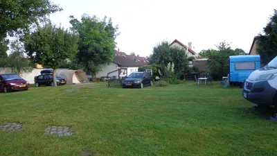 a group of cars parked in a yard at Pension Camp Prager in Prague